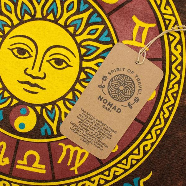 Close-up of sun zodiac print on brown T-shirt with Spirit of Travel brand hang tag