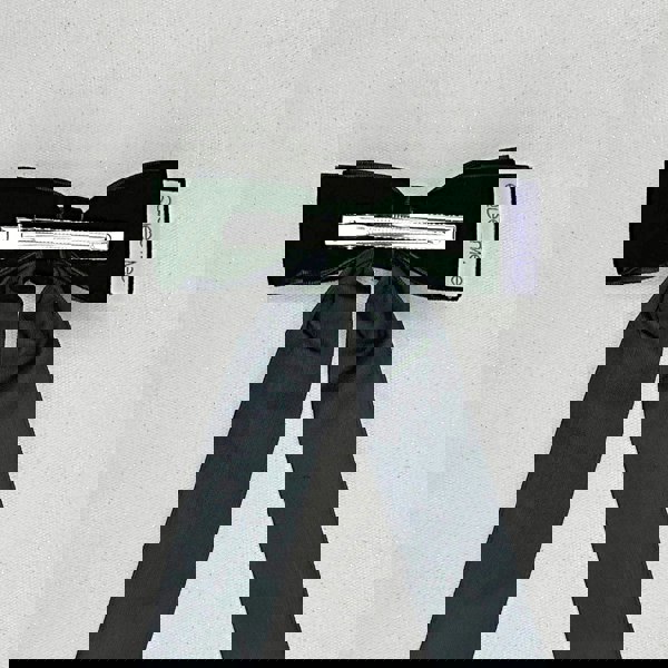 Black velvet hair bow, alligator clip, classic style, elegant accessory, secure hold.
