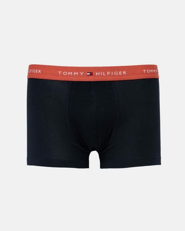 Navy trunks with reddy orange waistband