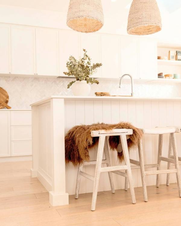 Mocha Mongolian Sheepskin Rug draped on chair