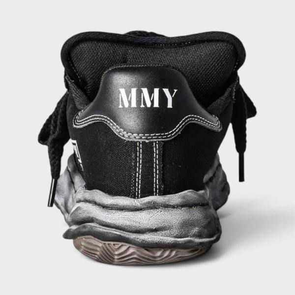 Supplied Fashion Yasuhiro Blakey Puffer black canvas sneaker showing the rear view with MMY logo and distressed sole