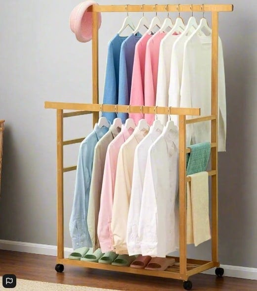 Wooden garment rack on wheels for bedroom or hallway storage

