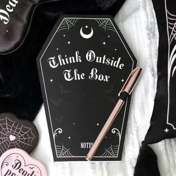 Coffin-shaped notebook with black cover, 'Think Outside The Box' and NOTES