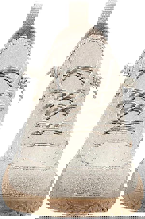 Rocket Dog Ruby Womens Casual Slip On Elastic Trainers, front view of beige slip-on sneakers with elastic laces and rugged sole design.