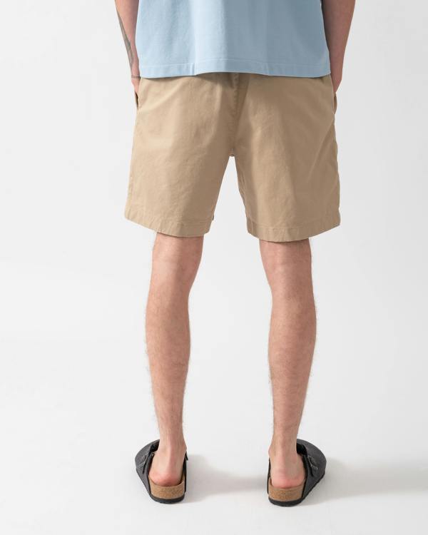 back of model wearing Lacoste Relaxed Fit Mens Stretch Cotton Shorts in Viennese 02S
