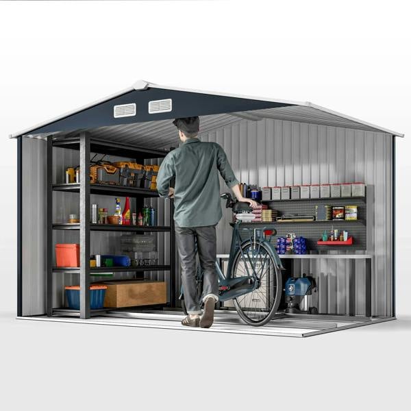Dark grey metal bicycle shed interior with shelving and a bicycle