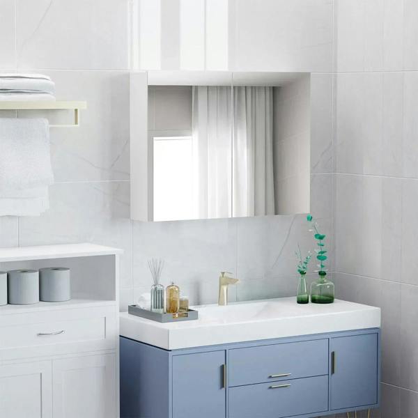 White double-door bathroom mirror cabinet above sink with mirror doors closed