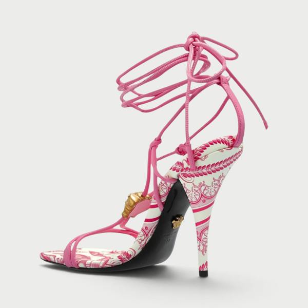 Supplied Fashion pink and white Barocco print square-toe heeled sandals with gold Medusa detail and lace-up straps.