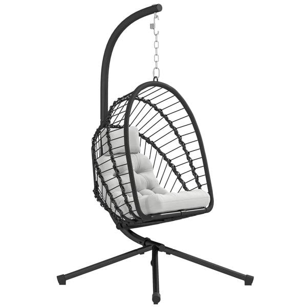 Black hanging egg chair with woven basket, metal stand, and white cushion