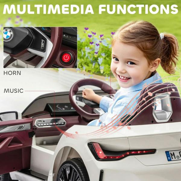 Kids electric ride-on car interior with maroon steering wheel, horn and music buttons.