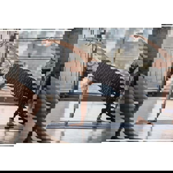 Yoga class doing a yoga pose on Reebok 4mm Yoga Mats - Brush Strokes