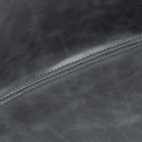 Close-up of dark grey PU leather bar stool seat seam with contrast stitching