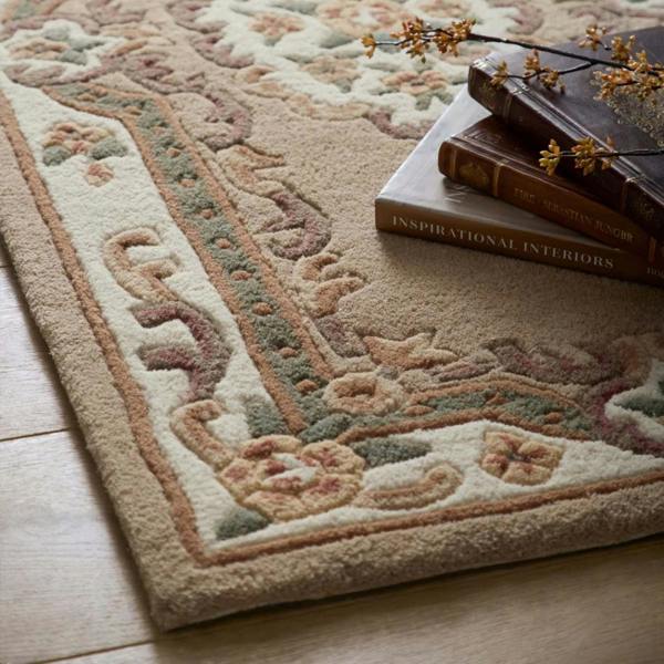 Decorative rug with intricate patterns on a wooden floor