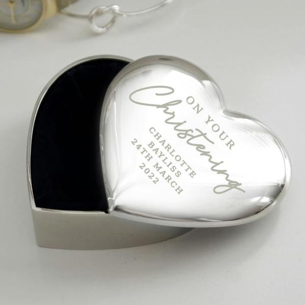 A silver nickel-plated Personalised Christening Heart Trinket Box with a dark fabric interior engraved with On your Christening Charlotte Bayliss 24th March 2022.