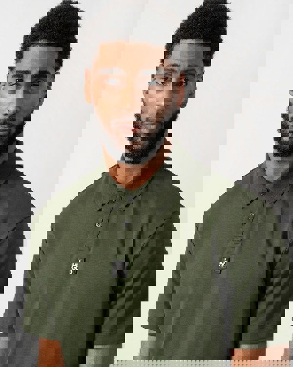 close up of a model wearing a HUGO Deabono Mens Interlock Cotton Polo Shirt with Stacked Logo in Dark Green