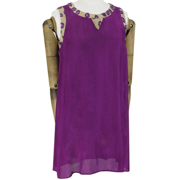 An embroidered lip and mesh edged dress by Giles