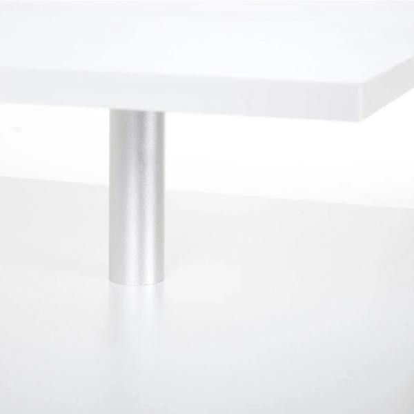 Aluminum leg detail on a white 2-tier coffee table with open shelf