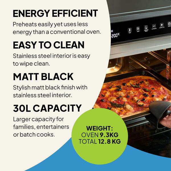 A person pulls a tray of pizza from the Fridja f77 Super Oven Pro - 30L Digital Air Fryer Oven. Features: PFAS free, energy efficient, easy-clean stainless steel, matt black finish, 9.3kg oven weight, 12.8kg total weight.