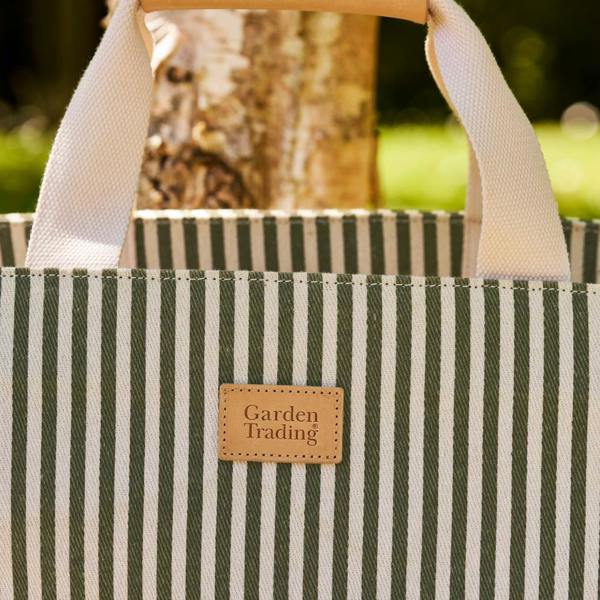 Close-up of the moss green and cream striped cotton canvas weave.