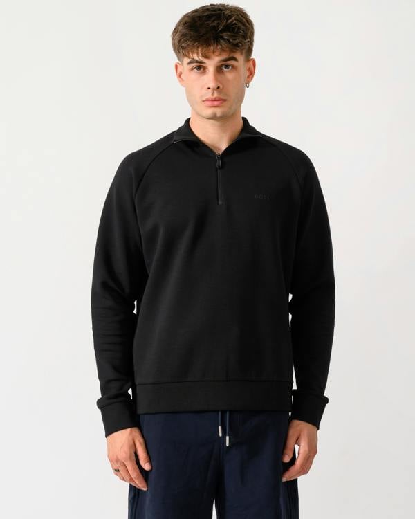 model wearing a BOSS Green Sweat Mens 1/4 Zip Sweatshirt in Black 001