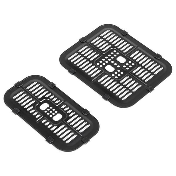 Two black removable nonstick fry pans with raised ridges and handle slots