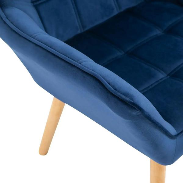 Blue upholstered armchair with wide padded arm and smooth rounded edges