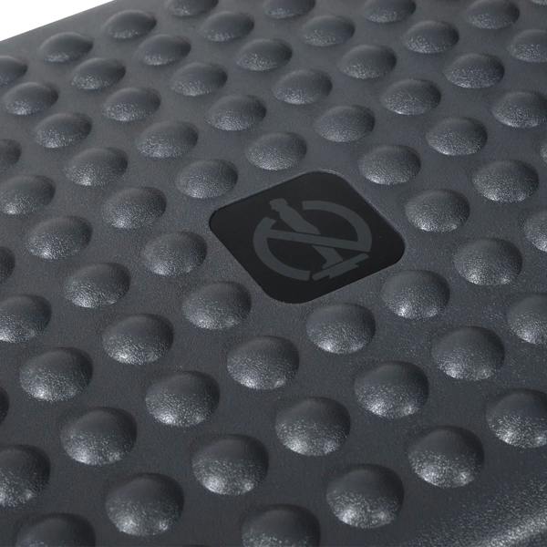 Charcoal grey footrest top with raised dot texture for grip and comfort