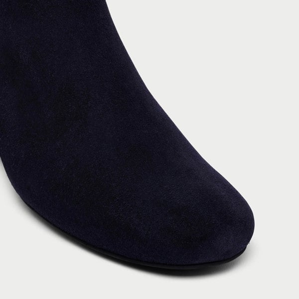 navy lexie suede boot on white background tip close up