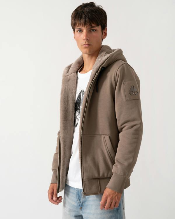 side of amodel wearing a Moose Knuckles Classic Bunny 3 Mens Fleece Hoodie in Ashen 2019
