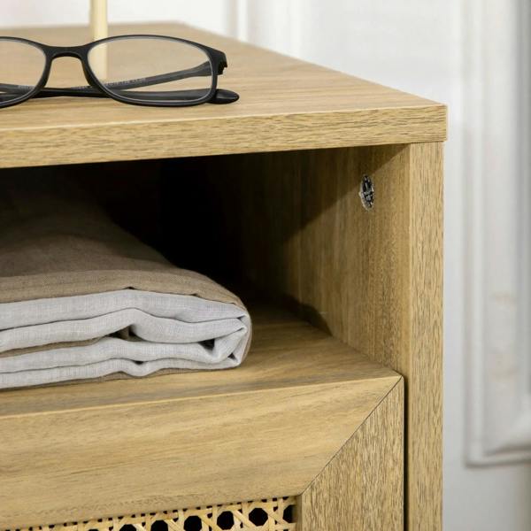 Close view of natural wood rattan nightstand: open shelf edge and cabinet corner