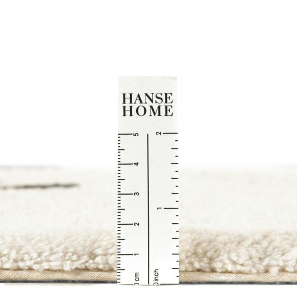 Measurement ruler showing dimensions of a rug with 'Hanse Home' branding.