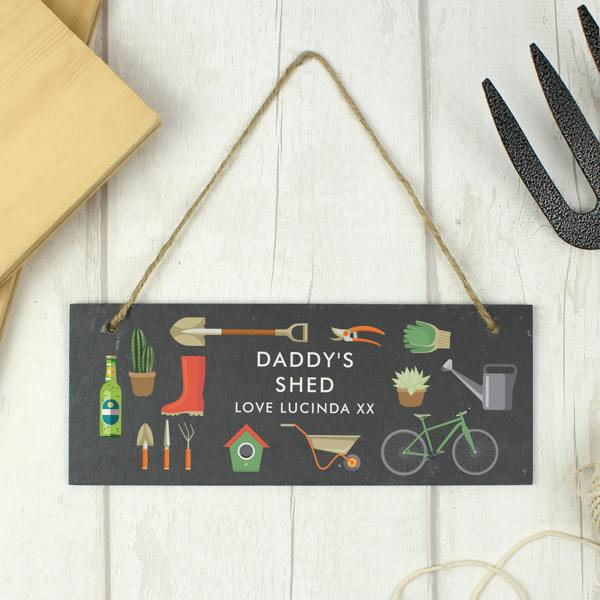 A rectangular hand-cut dark slate sign with rustic hanging twine, bright workshop tool illustrations, and custom text reading Grandad's Workshop No Tools Taken.