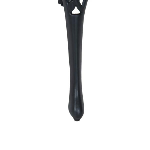 Black curved cast metal table leg with glossy finish