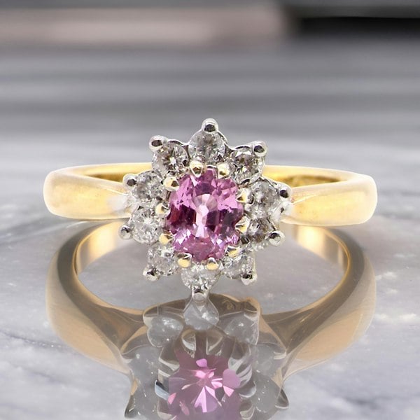 A Pink Sapphire and Diamond cluster ring