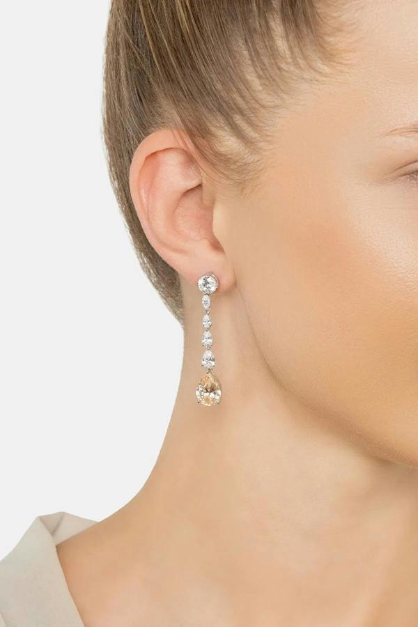 The earring worn by a model.