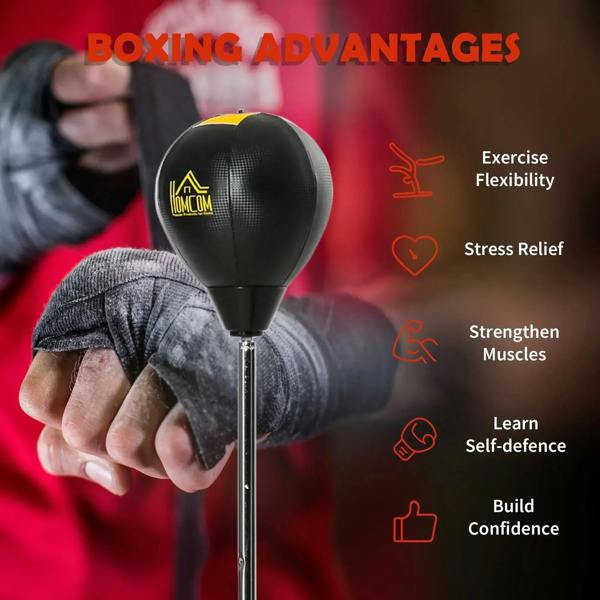 Black punching bag ball on stand during training workout