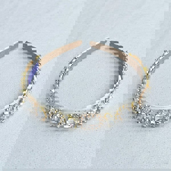 White jewelled headband, slim design, crystal embellishments, vintage inspired style, elegant decorative hair accessory
