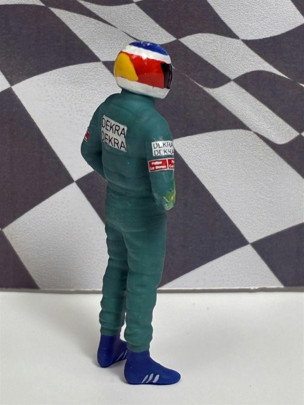 a toy figure of a man wearing a helmet