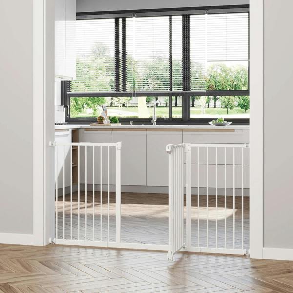White adjustable safety gate set across doorway with hinged gate panel and base mounts