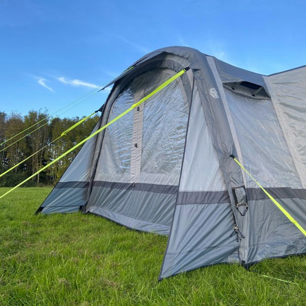 The Cocoon Breeze® XL v2 Motorhome Awning (Grey) from OLPRO pictured in a campsite attached to a VW Crafter Camper Van