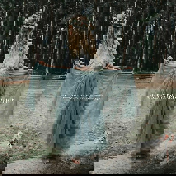 Flower girl playing with dress