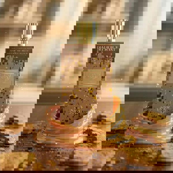 Anfar 1950 Biscotti Truffle Dubai Chocolate Extrait 80ML bottle with biscotti background