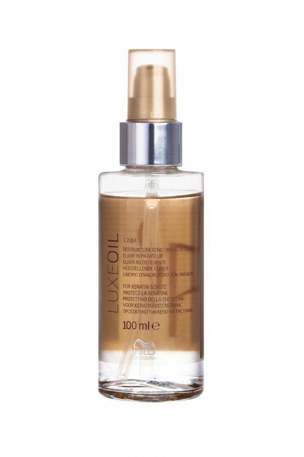 LuxeOil hair oil bottle with gold cap on a white background