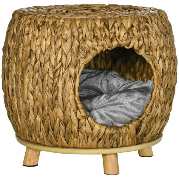 Round wicker cat bed house with an open doorway and a grey cushioned insert