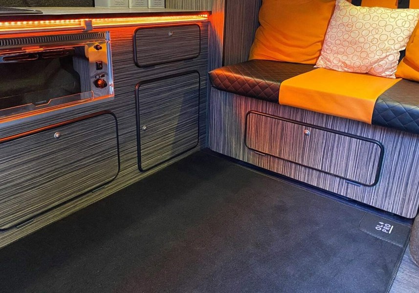 A photo of the Rear Campervan Living Area Carpet 900mm x 1000mm being used within a campervan on the living space of the vehicle.