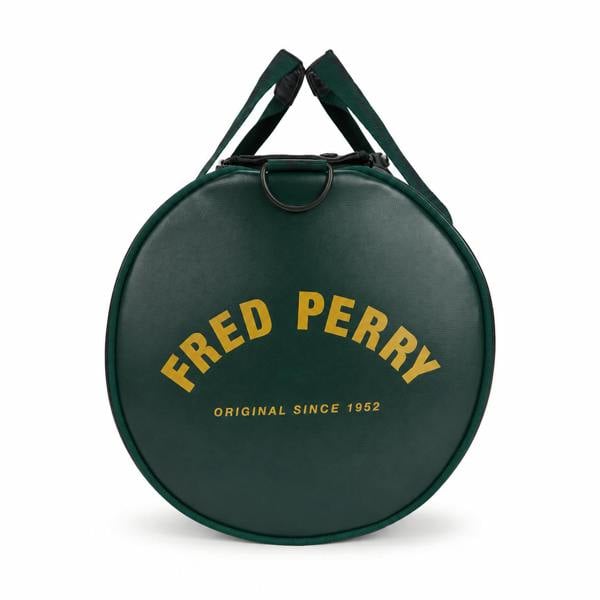 Fred Perry Classic Barrel Bag in dark green with yellow logo, showing the round end and top handles.