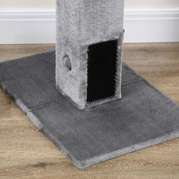 Close-up of carpet base with grey plush post and black bristle grooming brush