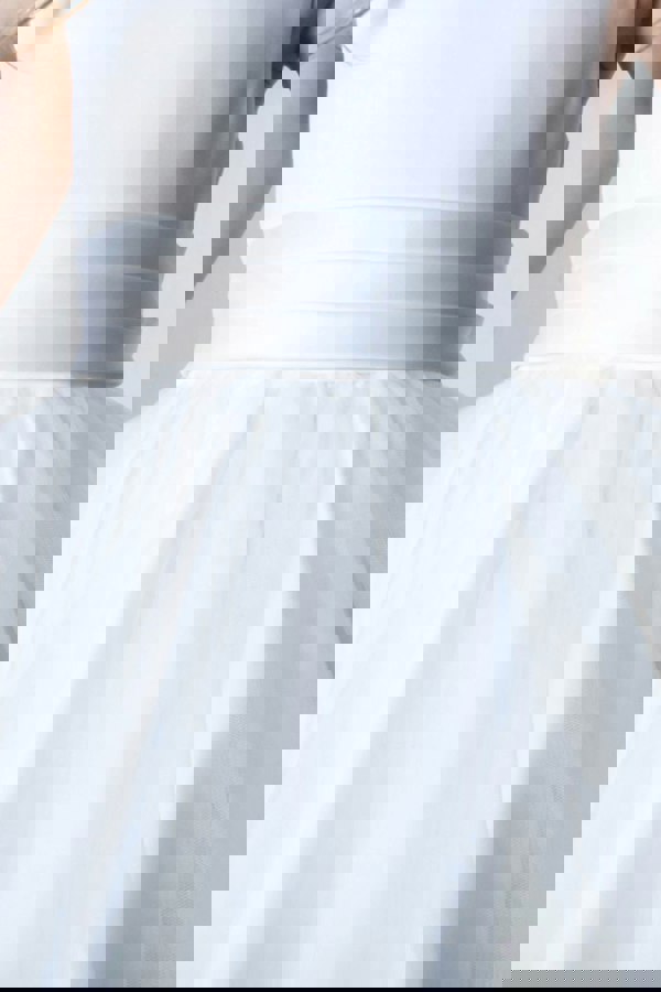 White dress with a belt on a plain background