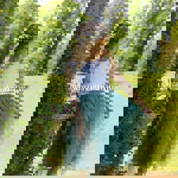 Young girl holding dress