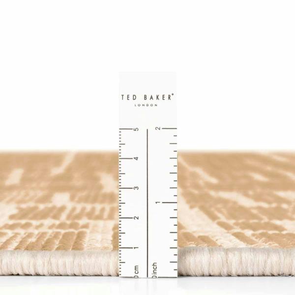 Ted Baker fabric swatch with a ruler for scale on a white background